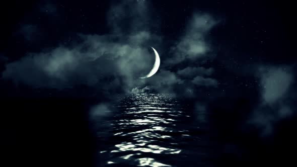 Crescent Moon Above The Sea On A Cloudy Starry Night