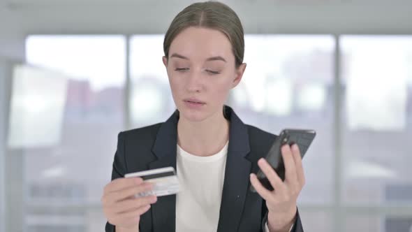 Portrait of Young Businesswoman Making Online Payment on Smartphone