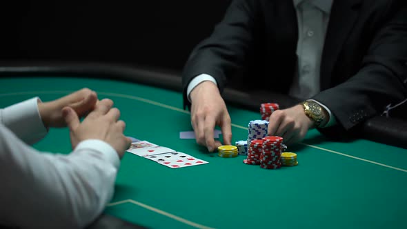 Rich Businessman Making Big Bets, Playing Poker at Illegal Casino, Addiction