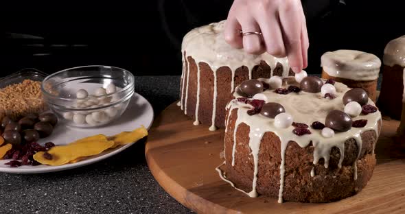 The person decorates the festive Easter cake