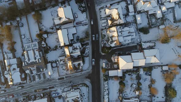 Snowy Streets and Houses in the Early Morning Bird's Eye View