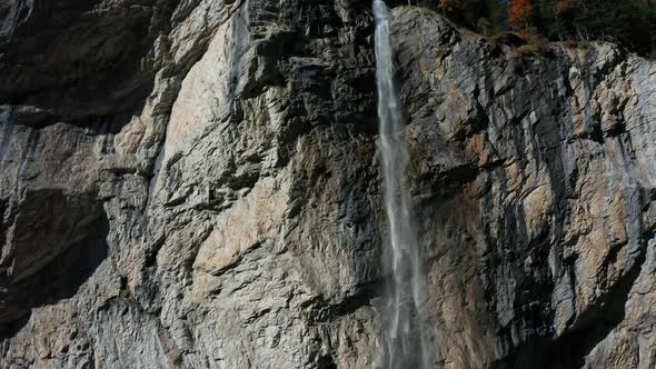 Aerial View of a Waterfall and Rainbow in the Village of Lauterbrunnen. Switzerland in the Fall