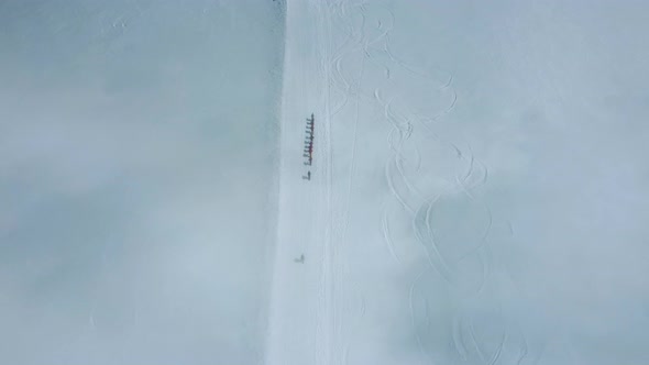 Extreme Climbing to Mountain Aerial View of Touristic Group Walking Up at Top Ever Snowed Slope