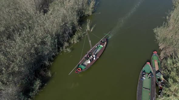 Aerial Drone Footage of a Boat with Tourists on It to Visit the Natural Park of the Albufera in