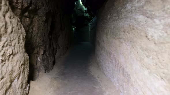 Speleology, cave, dungeon, dark tunnel, underground excavations. The old cave is formed by water