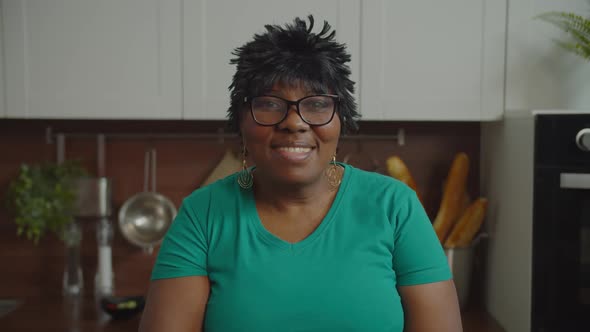 Positive Mature African Woman Giving Thumbs Up Indoor