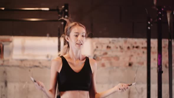 Female Athlete Training Hard At Fitness Club