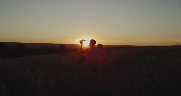 Dreaming Big Son with His Dad at Sunset, Playing