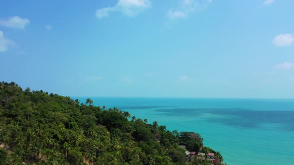 Aerial flying over sky of paradise shore beach lifestyle by blue water and white sandy background of