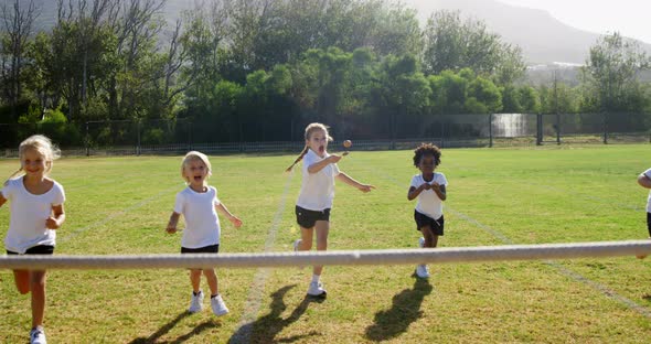 Children playing lemon and spoon race