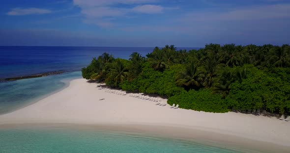 Luxury aerial island view of a sandy white paradise beach and aqua blue water background in hi res 4