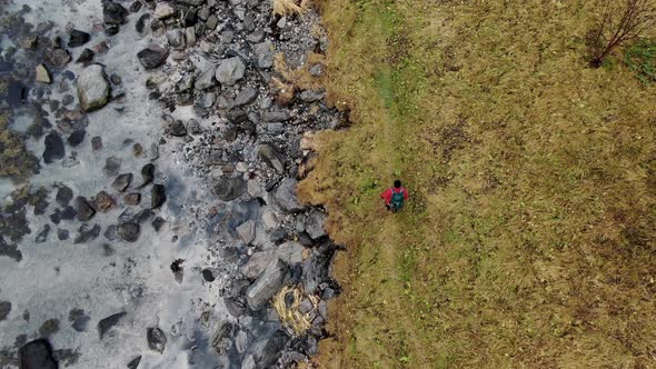 Drone Over Hiker Next To Fjord