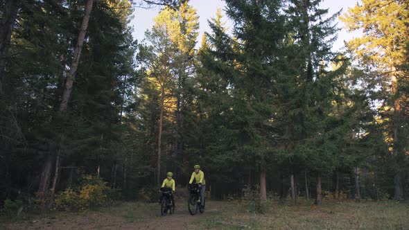 The Man and Woman Travel on Mixed Terrain Cycle Touring with Bikepacking