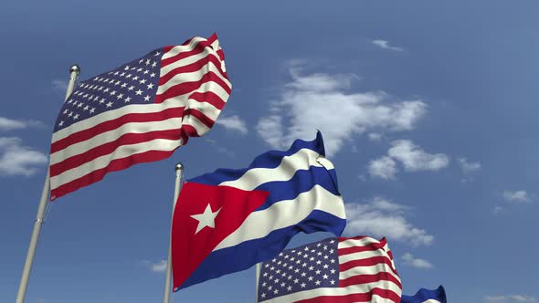 Flags of Cuba and the USA Against Blue Sky