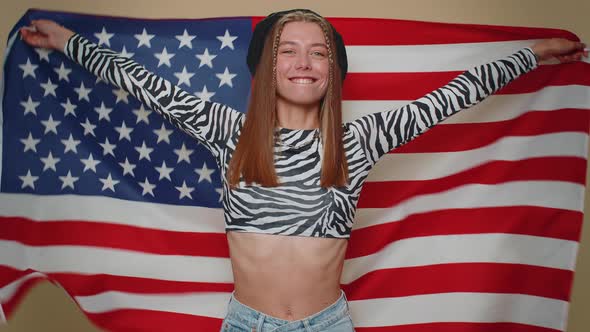 Lovely Young Woman Waving and Wrapping in American USA Flag Celebrating Human Rights and Freedoms