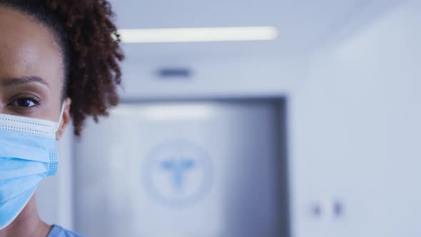 Portrait of mixed race female doctor wearing face mask