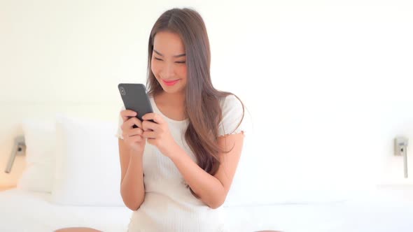 Young asian woman use smart phone