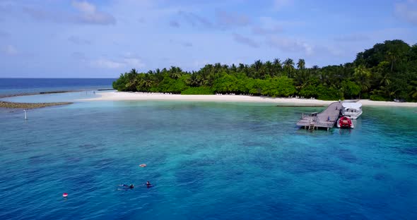 Wide drone abstract view of a sunshine white sandy paradise beach and aqua turquoise water backgroun