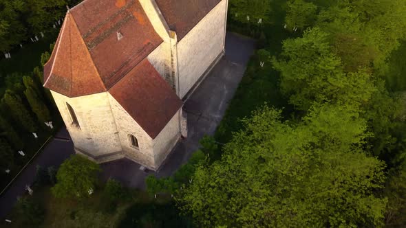 Round View Of Beautiful Church between trees forest And View of monument Town Cluj, Romania, Transyl