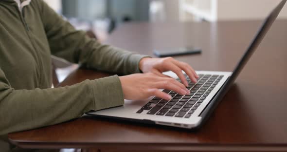 Woman type on computer