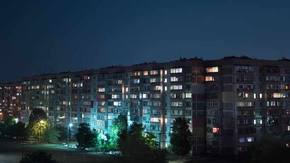 Multistorey Building with Changing Window Lighting At Night. Timelapse