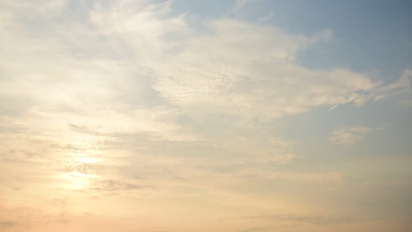 Time lapse sunset sunrise and beautiful twilight fluffy storm cloudy blue and yellow sky