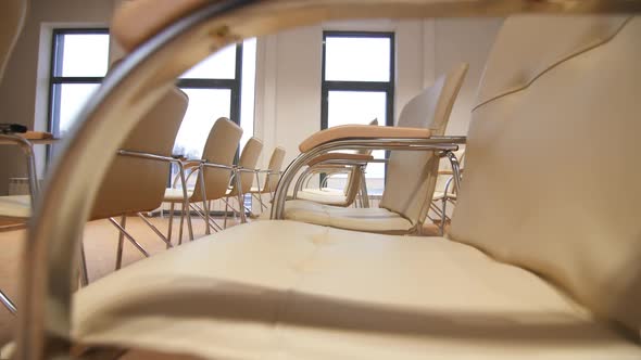 Armchairs in Empty Conference Hall for Business Symposium