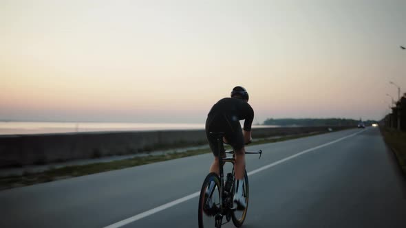 Sport Recreation Bike Cycling On Sunset. Cyclist In Helmet Riding. Triathlon Time Trial Bicycle.