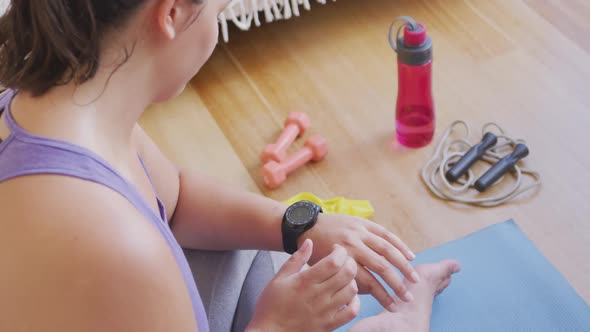 Caucasian blogger female exercising at home