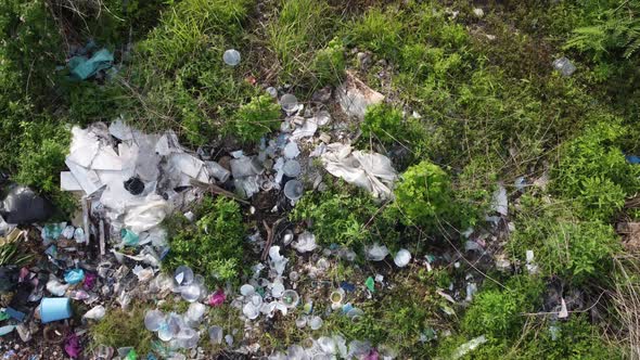 Aerial fly over rubbish thrown illegal near rural area