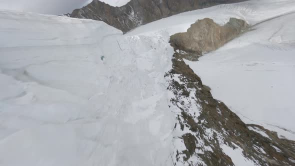 Aerial View Flight Over Cracked Glacier Natural Mountain Summit Picturesque Valley Landscape