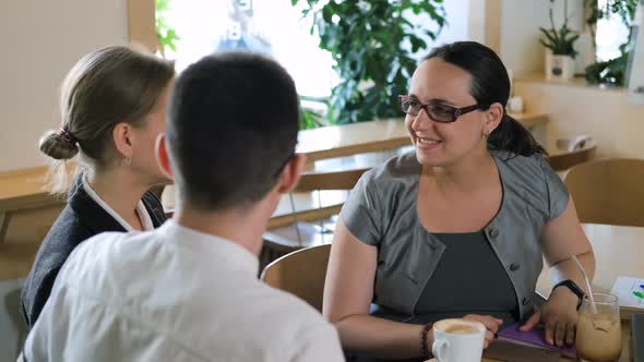 Colleagues Having Lunch Break at Coffee Shop