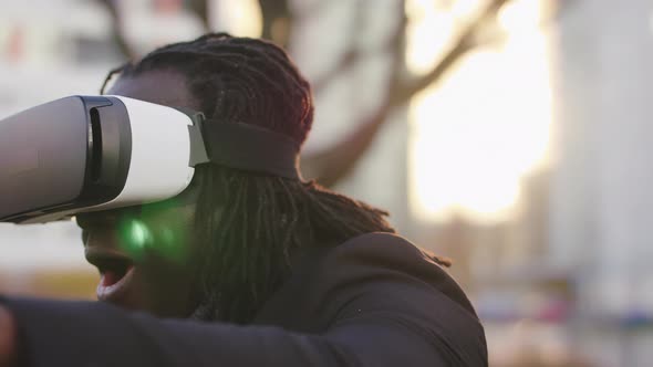 Excited Man with VR Headset Exploring Virtual Reality for the First Time