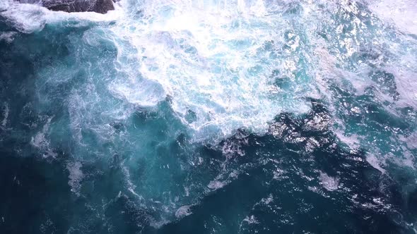 Strong blue waves in ocean crashing on the shore. Maroubra Beach, Sydney. Beautiful drone view on cl