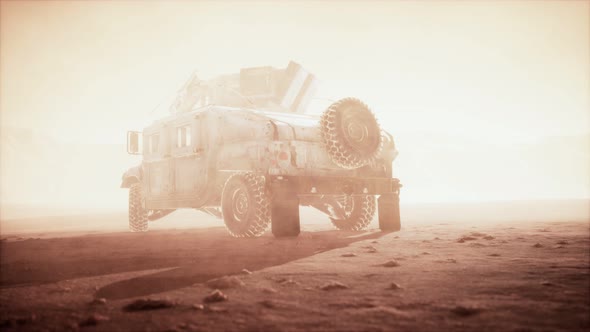 Military Patrol Car on Sunset in Desert Storm