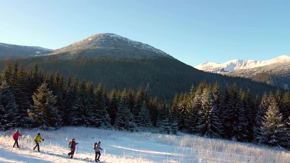 Four Travelers Pass By a Large Mountain