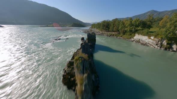 FPV Sport Drone Dynamic Shot Active Travel Woman Looking for Sun on Sharp Coast