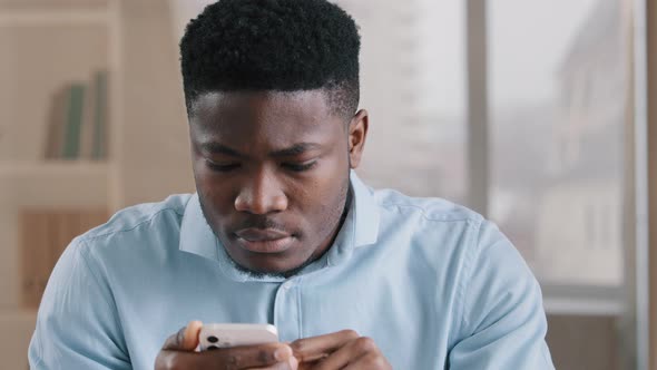 African Young Man Surprised Receive Good Message on Cellphone Win Online Bet Rejoice Passing Mobile