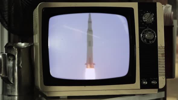 Apollo 11 Rocket Launch On a Small Retro TV. Zoom In.