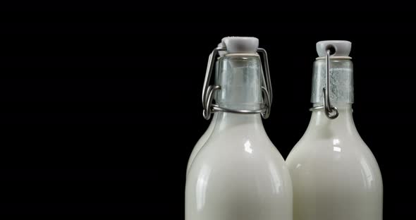 Closed Milk Bottles Rotate Slowly