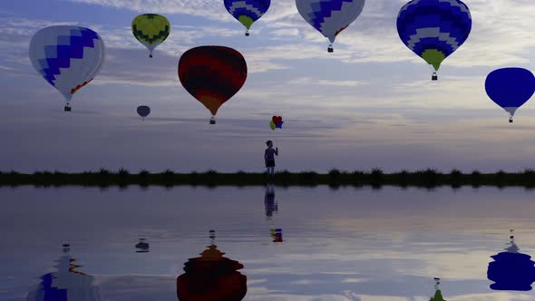 The Child Holding Balloons and Colorful Hot Air Balloons In Background 