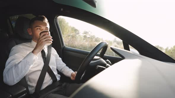 Relaxed Business Man Experience to Riding an Autonomous Self Driving Car and Drink a Coffee