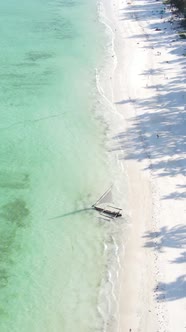 Vertical Video Boats in the Ocean Near the Coast of Zanzibar Tanzania