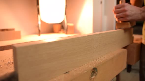 Carpenter Planing Wood in Slow Motion alt