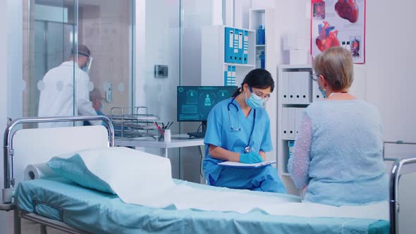 Nurse Talking with Retired Old Woman