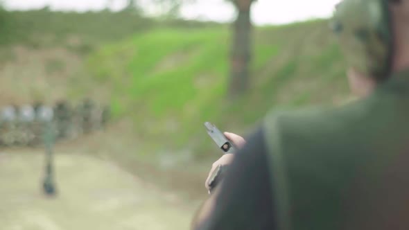 Close-up Shot of a Pistol. Slow Motion.