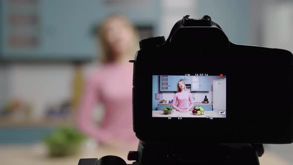 Young Woman Talks to Camera About Benefits of Face Cream Made From Natural Products