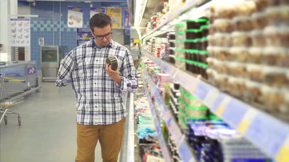 Disabled Man with an Amputated Hand in the Store Makes a Purchase