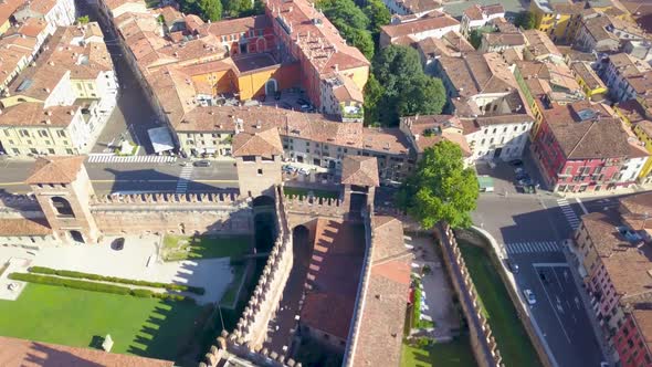 Verona, Italy: Aerial view of Castelvecchio Castle.Drone flies over the old city. Aerial video