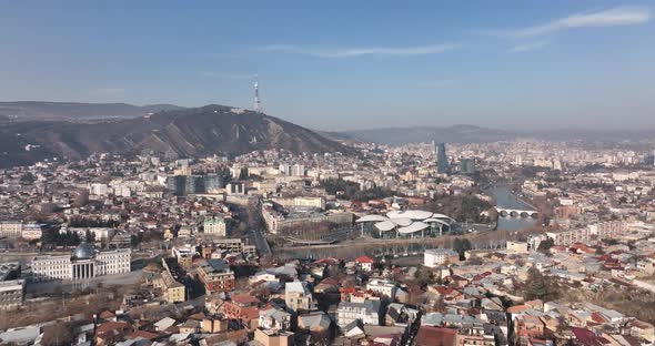 Aerial view of center of Tbilisi under Mtatsminda mountain, Georgia 2022 winter